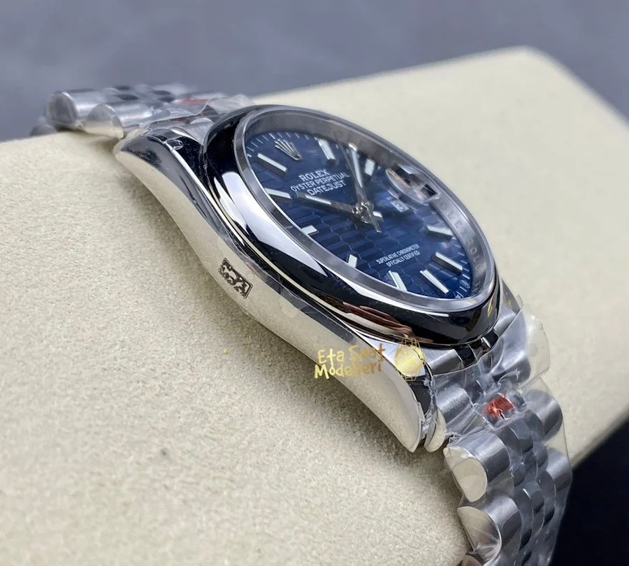 Replica Rolex Datejust 126200 Mavi Motif Dalga Desenli Kadran Pürüzsüz Bezel Unisex Saat