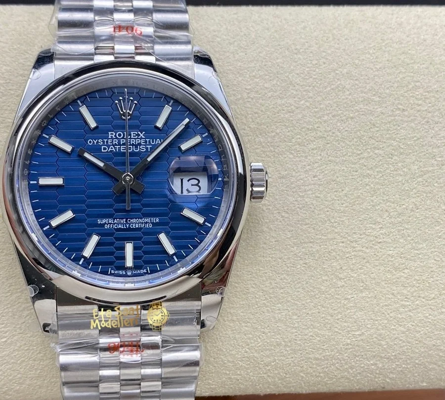 Replica Rolex Datejust 126200 Mavi Motif Dalga Desenli Kadran Pürüzsüz Bezel Unisex Saat