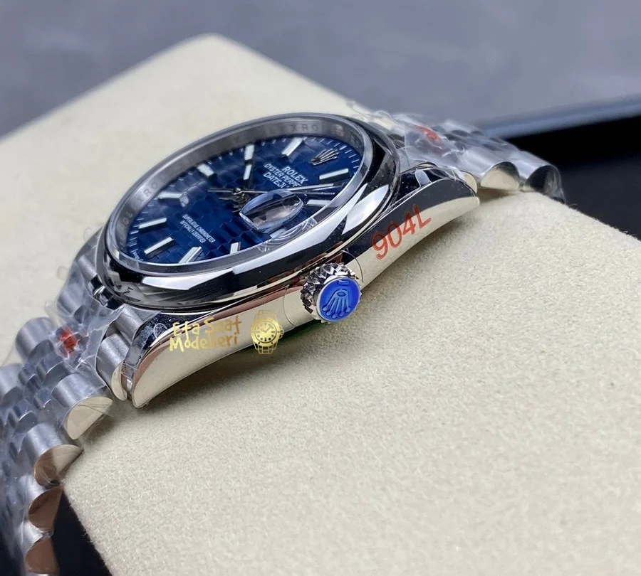 Replica Rolex Datejust 126200 Mavi Motif Dalga Desenli Kadran Pürüzsüz Bezel Unisex Saat