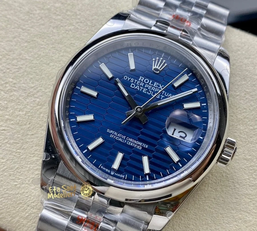 Replica Rolex Datejust 126200 Mavi Motif Dalga Desenli Kadran Pürüzsüz Bezel Unisex Saat