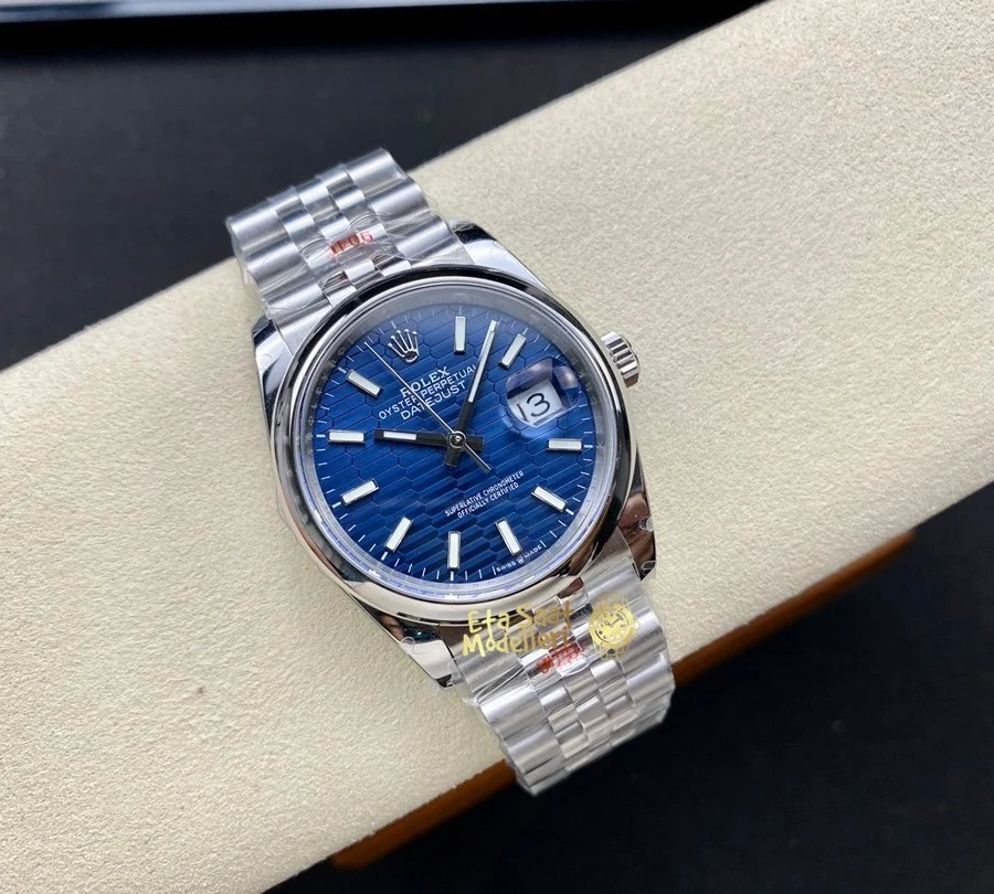 Replica Rolex Datejust 126200 Mavi Motif Dalga Desenli Kadran Pürüzsüz Bezel Unisex Saat