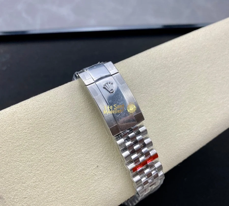 Replica Rolex Datejust 126200 Mavi Motif Dalga Desenli Kadran Pürüzsüz Bezel Unisex Saat