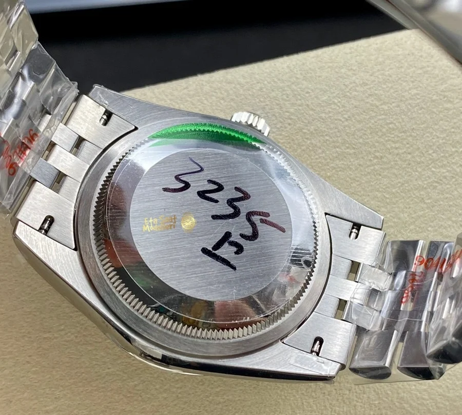 Replica Rolex Datejust 126200 Mavi Motif Dalga Desenli Kadran Pürüzsüz Bezel Unisex Saat